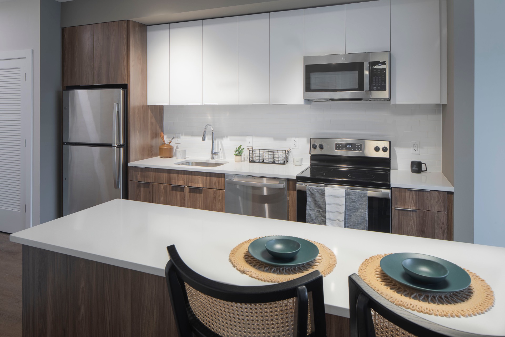 Apartment kitchen with island dining setting